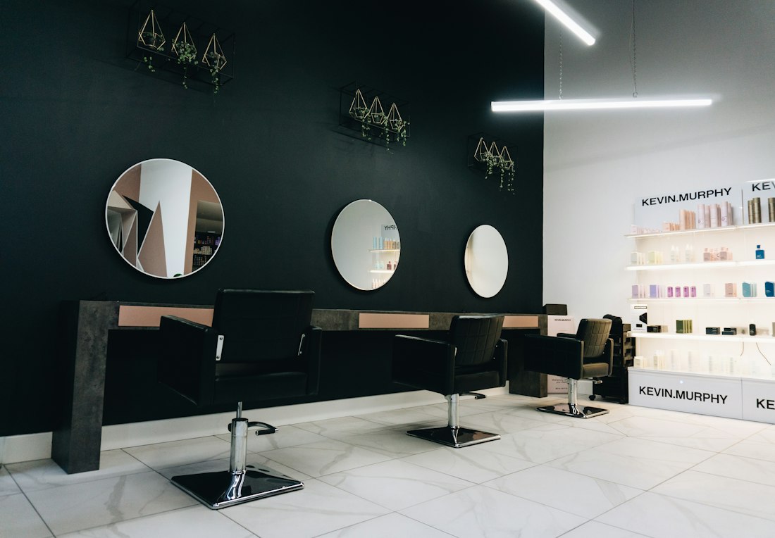 Elegant salon interior with round mirrors